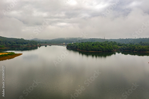 Aerial view of a misty lake in Kerala