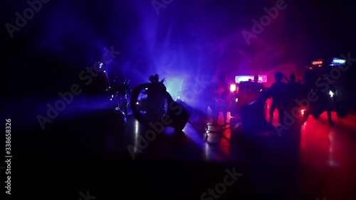 Corona virus concept with police. Stay home for precautionary measures to prevent from corona virus. Anti-riot police give signal to be ready. Smoke on a dark background with lights. Selective focus