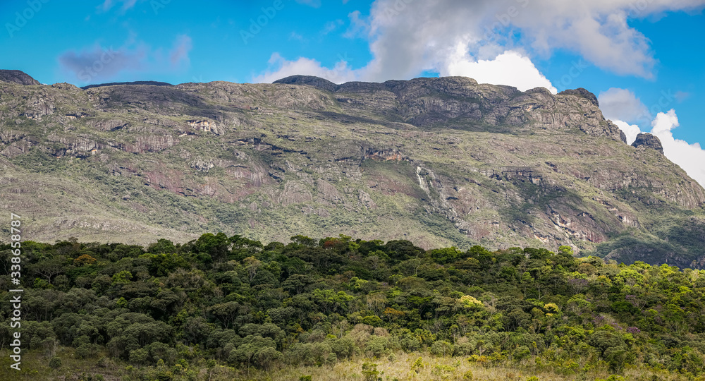 Impressive mountain scenery with shadows, blue sky and clouds, Caraca natural park, Minas Gerais, Brazil
