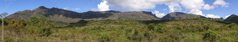 Panorama of beautiful green mountain scenery with blue sky and clouds of Caraca natural park, Minas Gerais, Brazil
