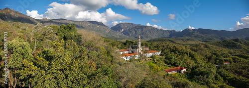 Aerial view panorama of Sanctuary Caraça with mountains and blue sky in background, Minas Gerais, Brazil photo