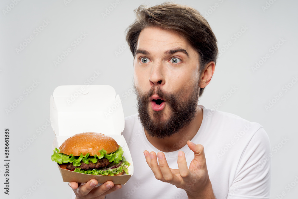 young man eating a sandwich