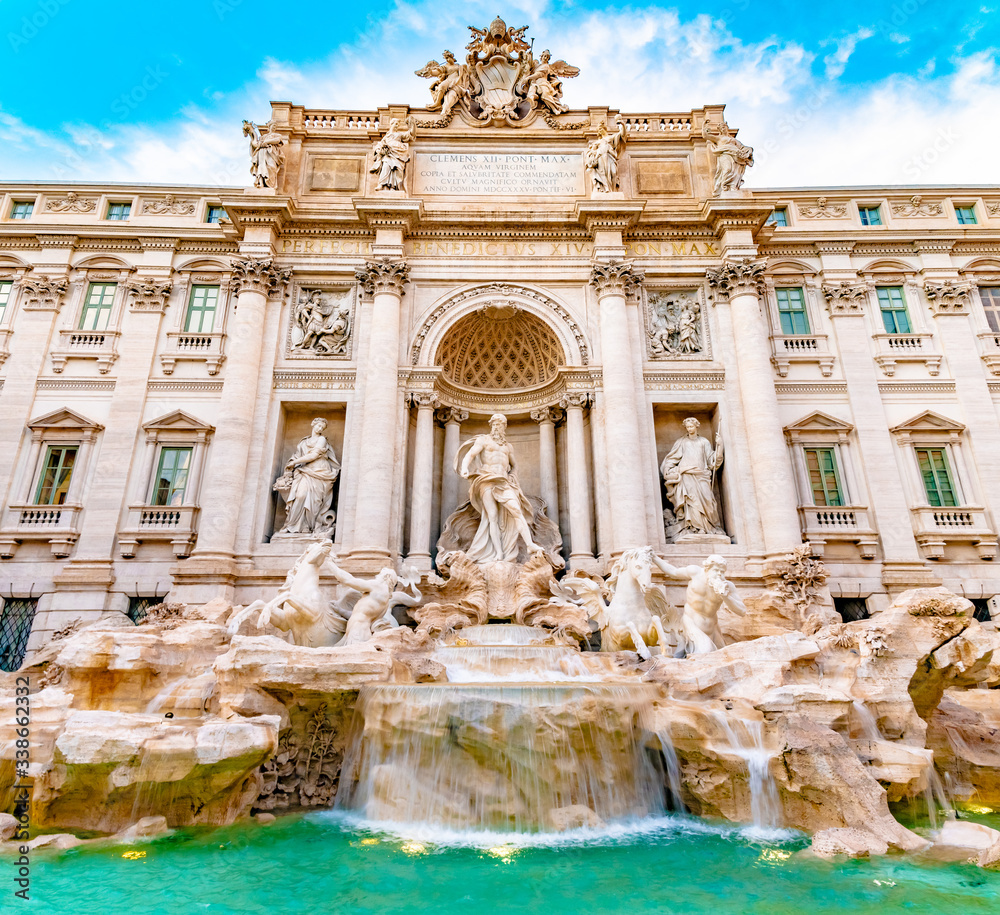 Trevi district, Rome, Italy. Palazzo Poli, a palace building, and Trevi Fountain, the largest baroque water fountain in the city. Popular tourist/ sightseeing attraction with pool for coin toss wishes