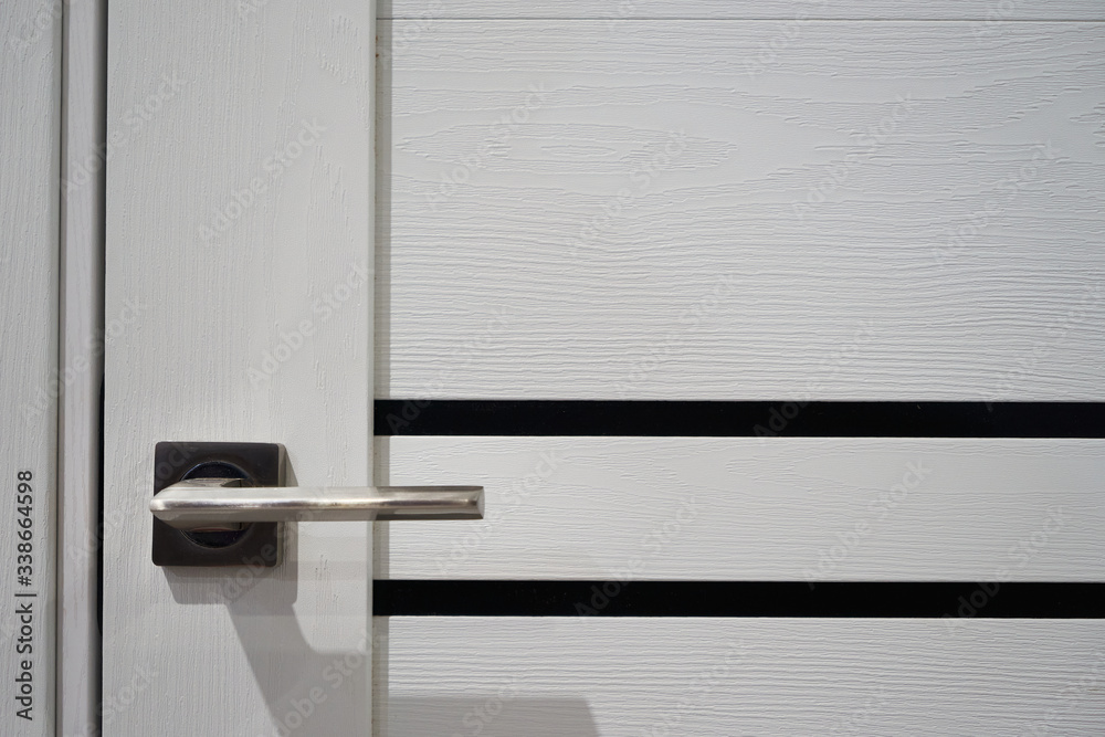 Door with a metal handle. Door with a metal handle.