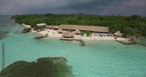 Mucura island near tourist reception from far away and the clear waters of paradaise photo