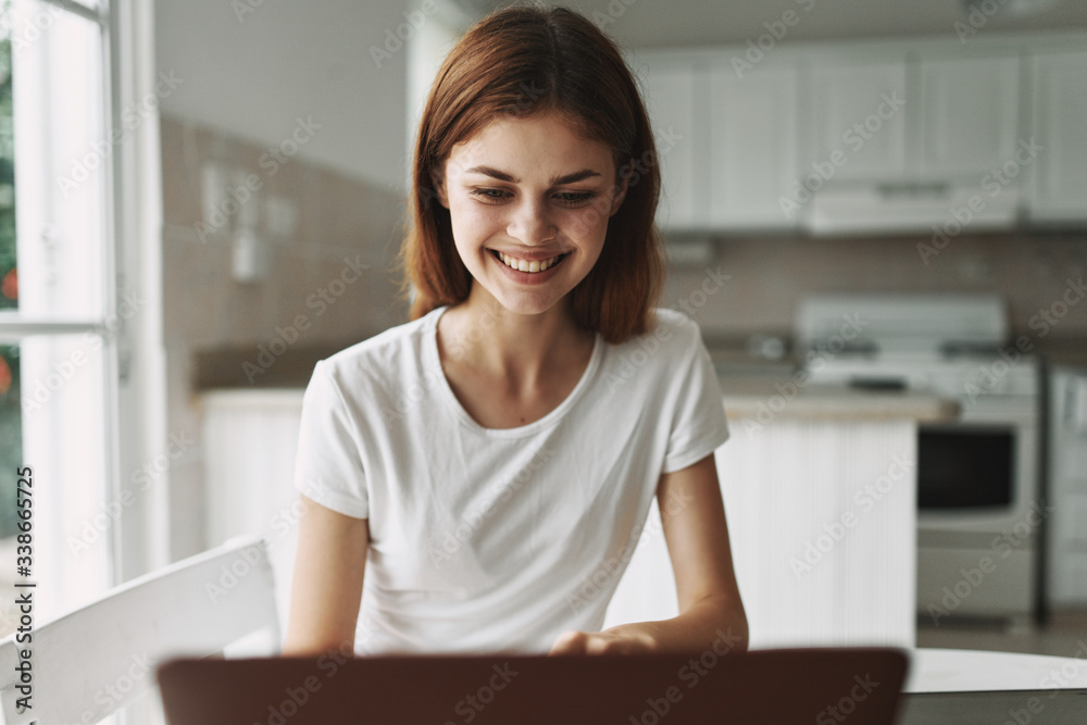 portrait of a young woman working on a laptop portrait of a young woman working on a laptop