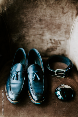 Man's shoes with belt and parfume