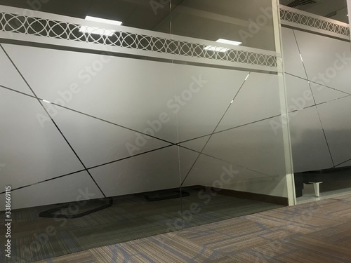 Images of Full height glass wall partitions for an office meeting room or manager room with an sticker of Frosted film for privacy of people for discussing in office interiors