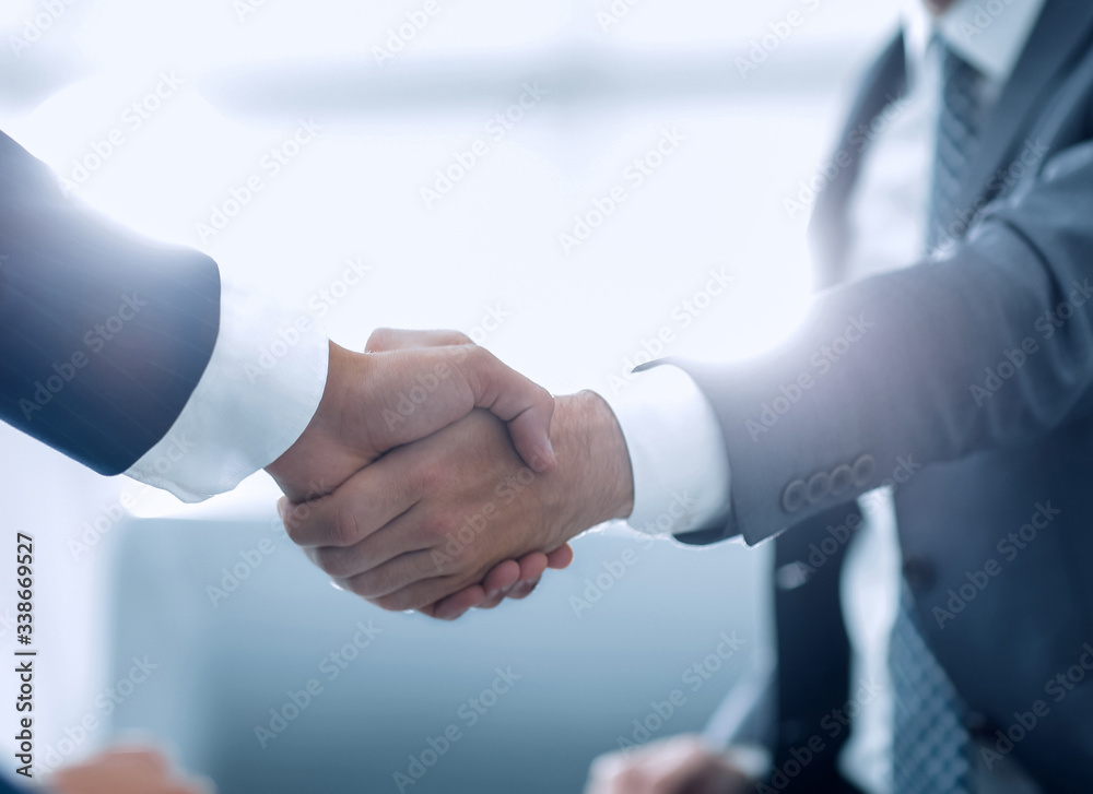 Close up of business handshake in the office