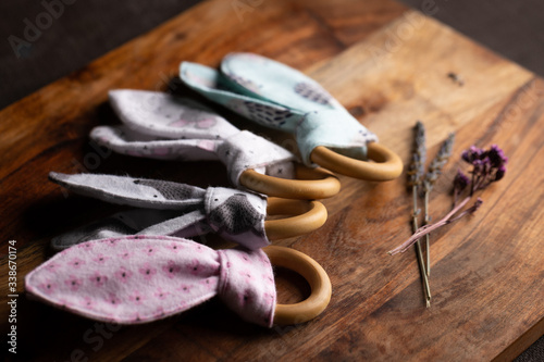 lavender flowers on wooden background and baby teething rings