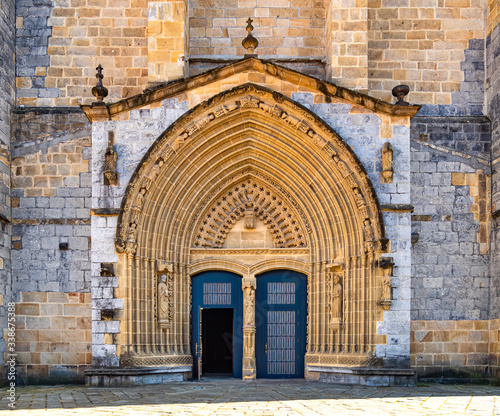 Φωτογραφία Entrance door and main facade of old stone church in Guernica, Basque Country, Spain