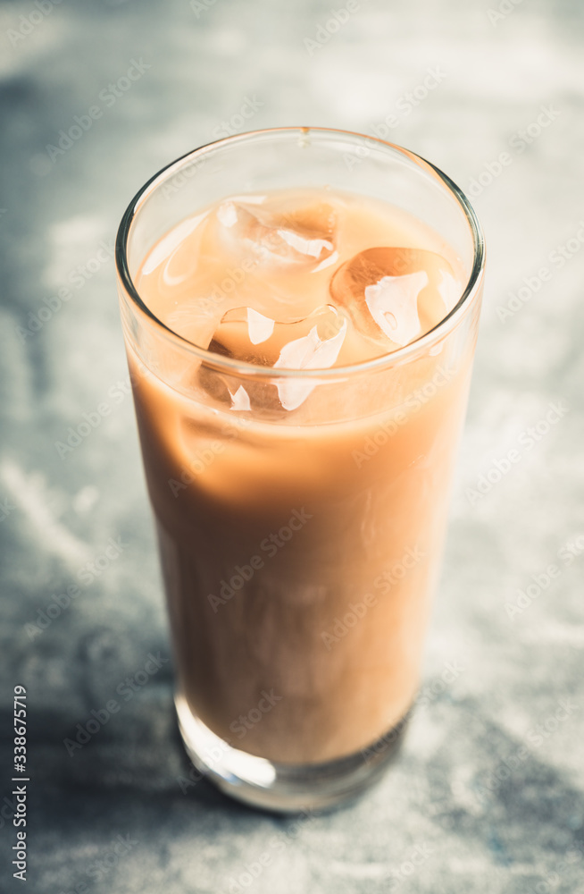 Iced coffee with cream on the rustic background. Selective focus. Shallow depth of field. Iced coffee with cream on the rustic background. Selective focus. Shallow depth of field.