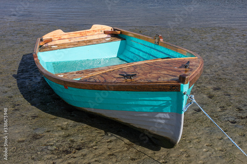 Fishing dinghy beached by the tide on Knysna lagoon