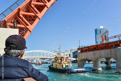 Busan city, South Korea - OCT 31, 2019: Tourists near drawbridge- Yeongdodaegyo Bridge in Jung-gu, Busan photo