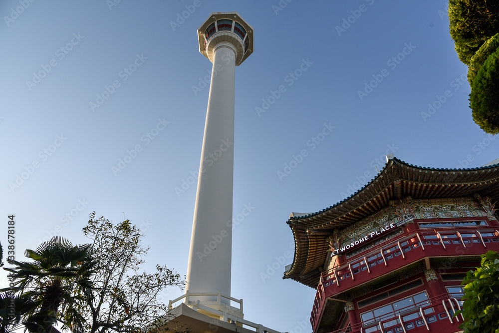 Busan city, South Korea - OCT 31, 2019: Bell pavilion of traditional Korean architecture and Busan tower in Yongdusan Park is a popular tourist destination of Busan City