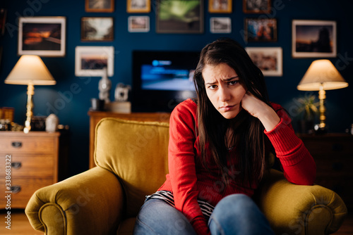 Stressed woman thinking of problems/solution.Annoyed and bored at home.Impatience and anger for partner.Irritating behavior annoyance.Doubtful disorder,indecisive person.Skeptic cynic personality