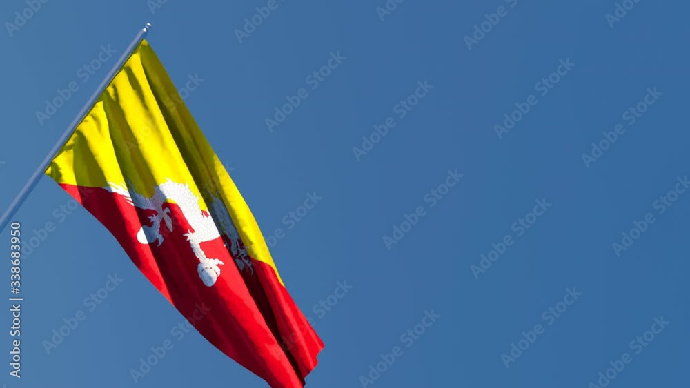 The national flag of Bhutan is flying in the wind