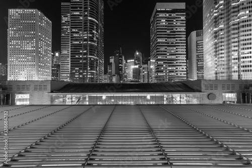 Photography Modern office building and skyline of Hong Kong city at night
