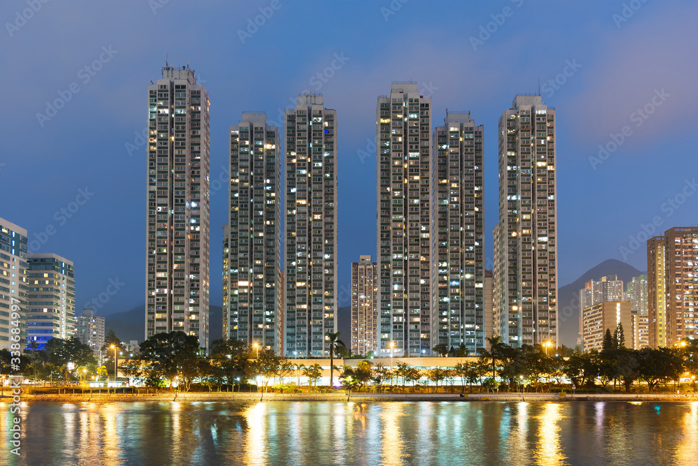 High rise residential building and river in Hong Kong city at dusk