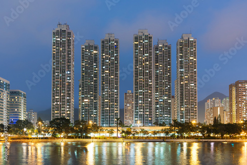 High rise residential building and river in Hong Kong city at dusk