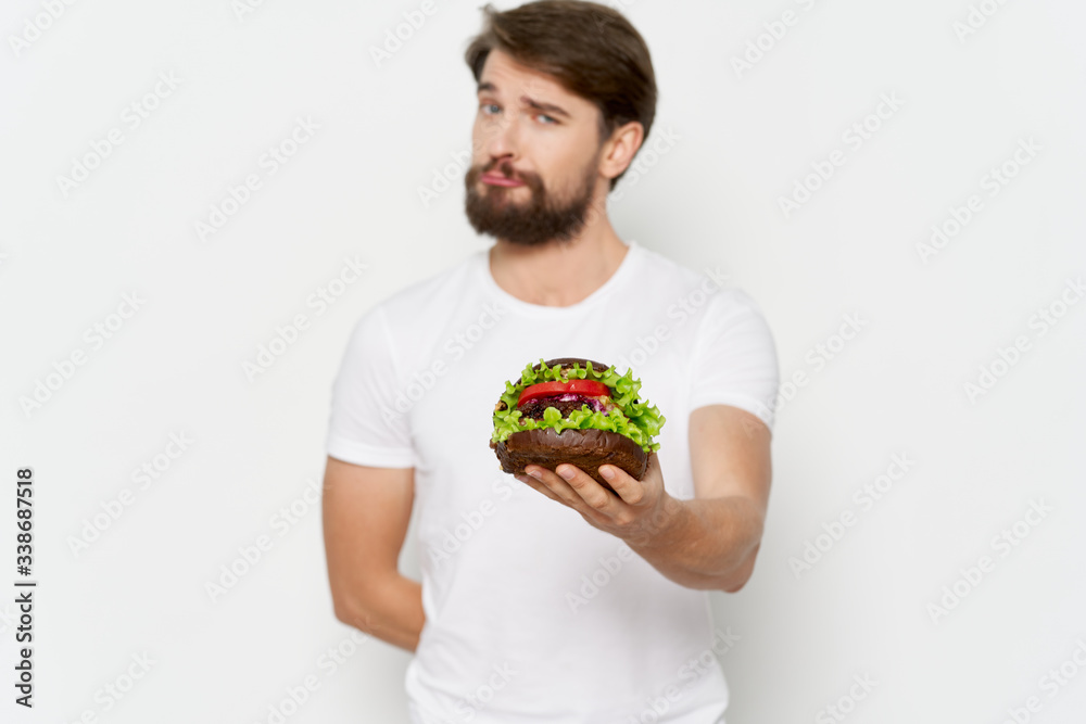 young man holding a bowl of salad young man holding a bowl of salad