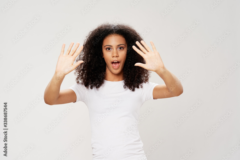 young woman with hands on head