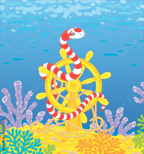 Striped red and white snake twisted around an old ship helm among corals of a colorful reef in a tropical sea, vector cartoon illustration