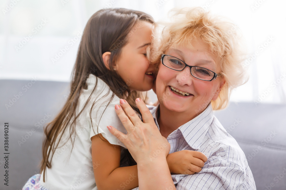 adorable playful little child girl with happy middle aged nanny grandma at home. Cute small preschool granddaughter with excited elderly grandmother. adorable playful little child girl with happy middle aged nanny grandma at home. Cute small preschool granddaughter with excited elderly grandmother.