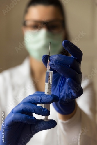 woman doctor holding syringe isolated