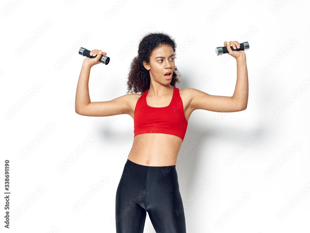 young woman lifting weights young woman lifting weights