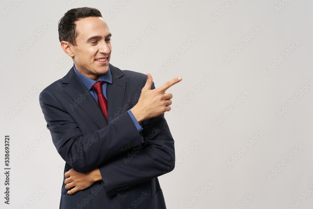 young businessman pointing at something young businessman pointing at something