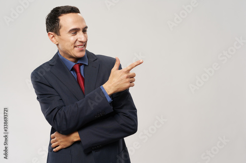 young businessman pointing at something