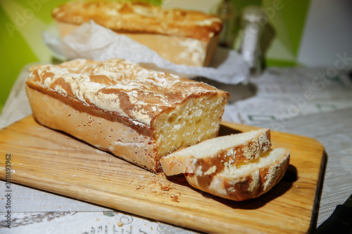 Homebaked bread. Sliced ​​pieces of bread. Home kitchen. We bake bread at home.