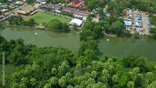 Aerial top view forest tree, Rainforest ecosystem and healthy environment concept and background, Wat Kham Chanot view from above. photo