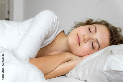 young woman sleeping in bed.