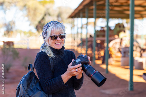 tourist with a camera at historic site photo