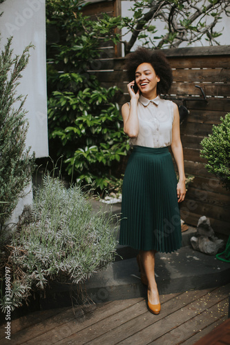 Young woman with a mobile p...