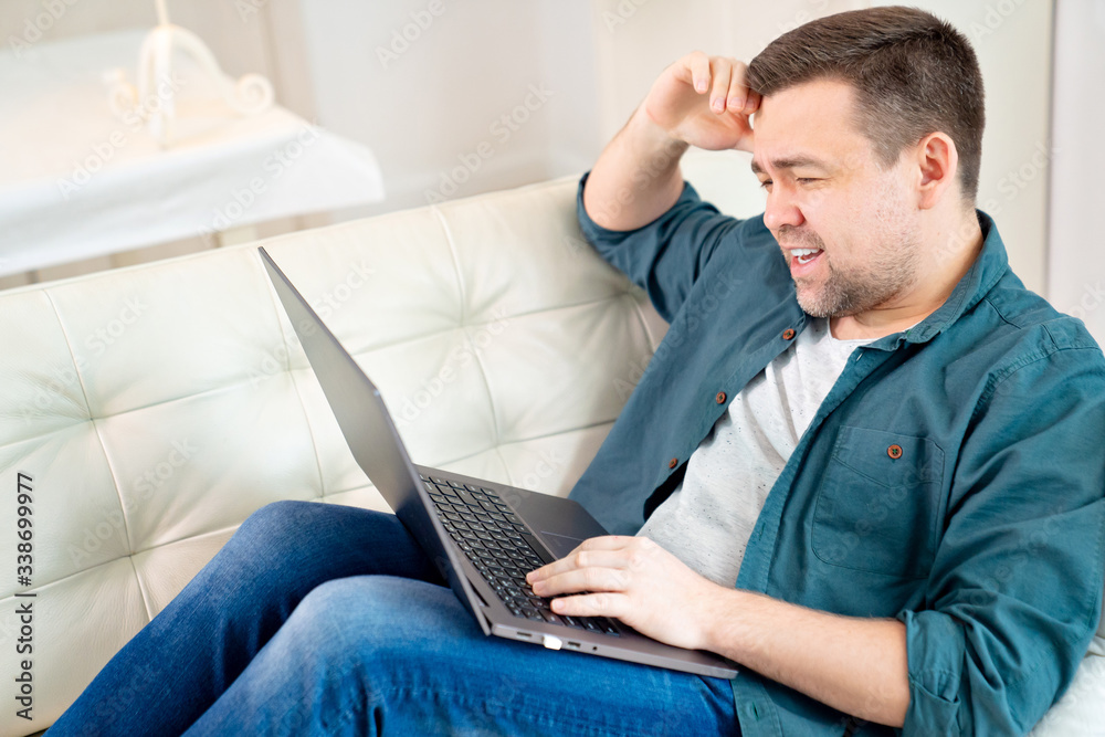 businessman working online lying on the couch. businessman working online lying on the couch.