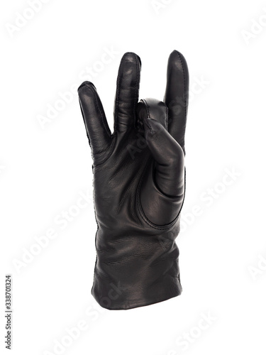 Isolated woman's hand wearing a black leather glove palm up, with the middle finger turned down and the thumb holding it in an ASL gesture meaning number eight