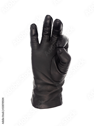Isolated woman's hand wearing a black leather glove in an OK or pinch gesture, palm up