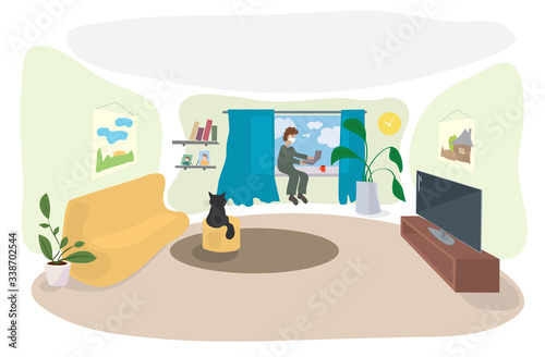 a man in a medical mask works on a laptop at home. time for remote work during quarantine