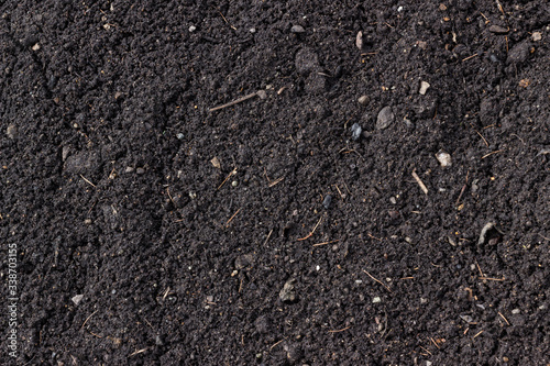 Close up of organic fertile soil. Dirty texture as background
