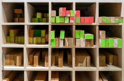 The stock of lumbers in a wood shelf. Detail of wood blocks in storage.