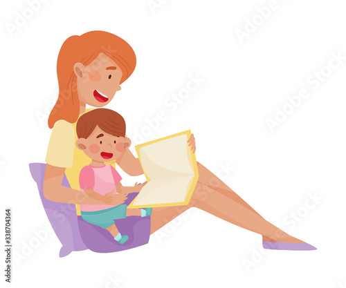 Young Smiling Mother and Her Little Baby Sitting and Reading Book Vector Illustration. Woman Spending Time with Her Kid