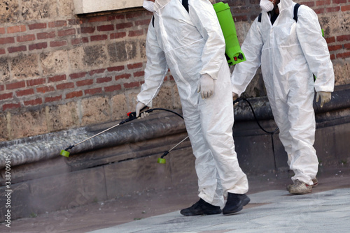 Workers spray disinfectant COVID-19 coronavirus