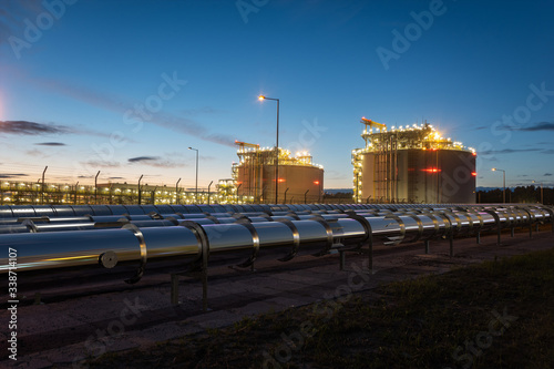 Obraz na płótnie Gas pipelines and gas tanks at the LNG terminal