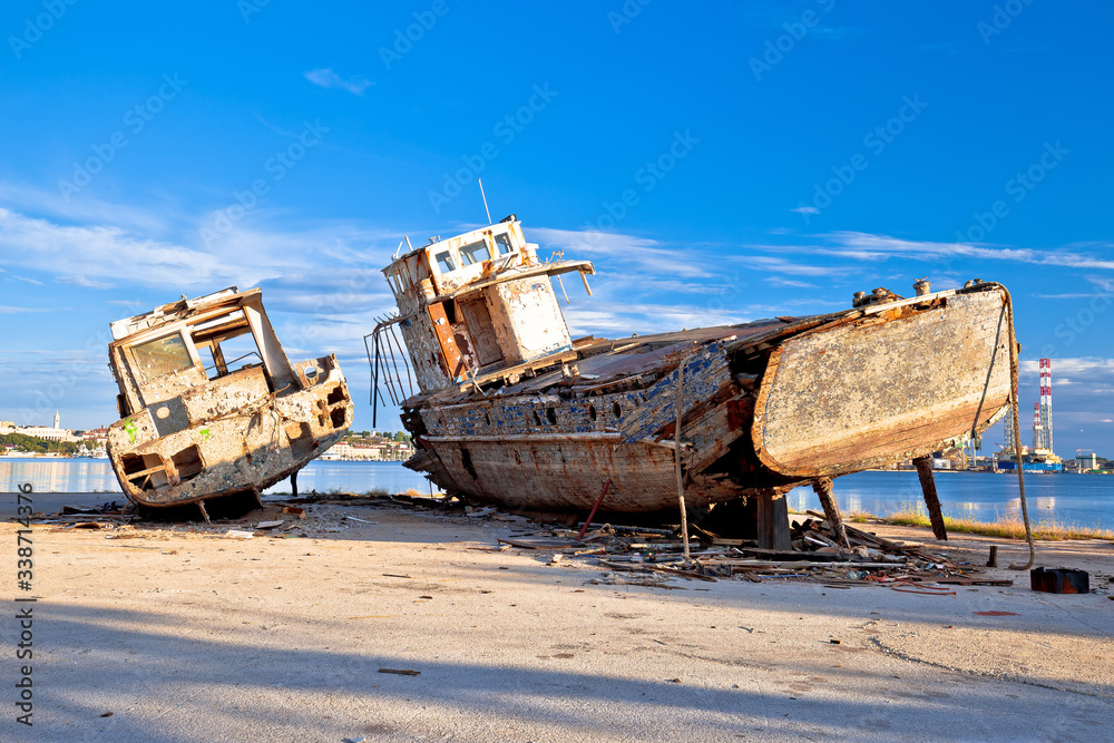 Old wooden boats wreck decay by the sea
