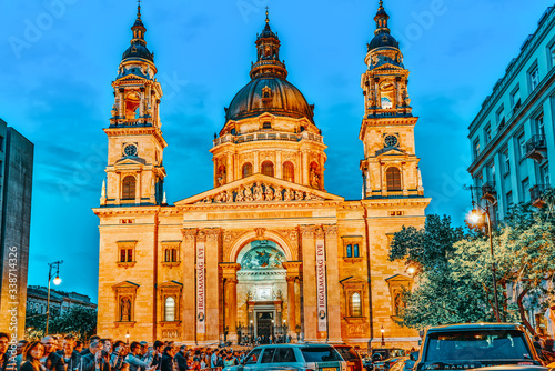 BUDAPEST, HUNGARY-MAY 05,2016: St. Stephen Basilica in Budapest at nightime and sport car show with peoples. photo