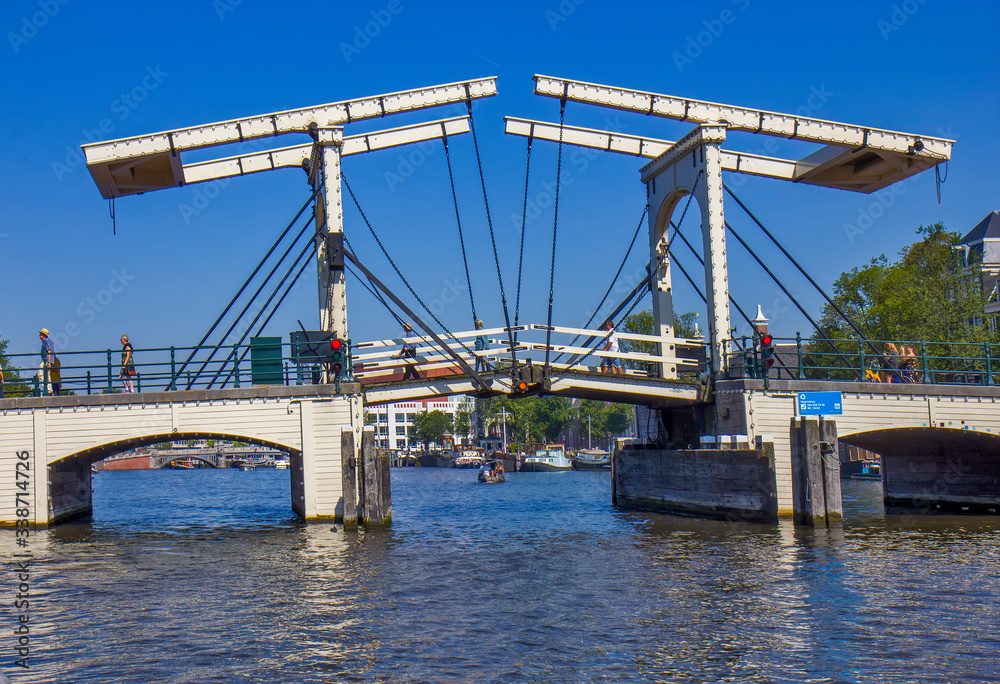Fototapeta premium Drawbridge on the river in Amsterdam