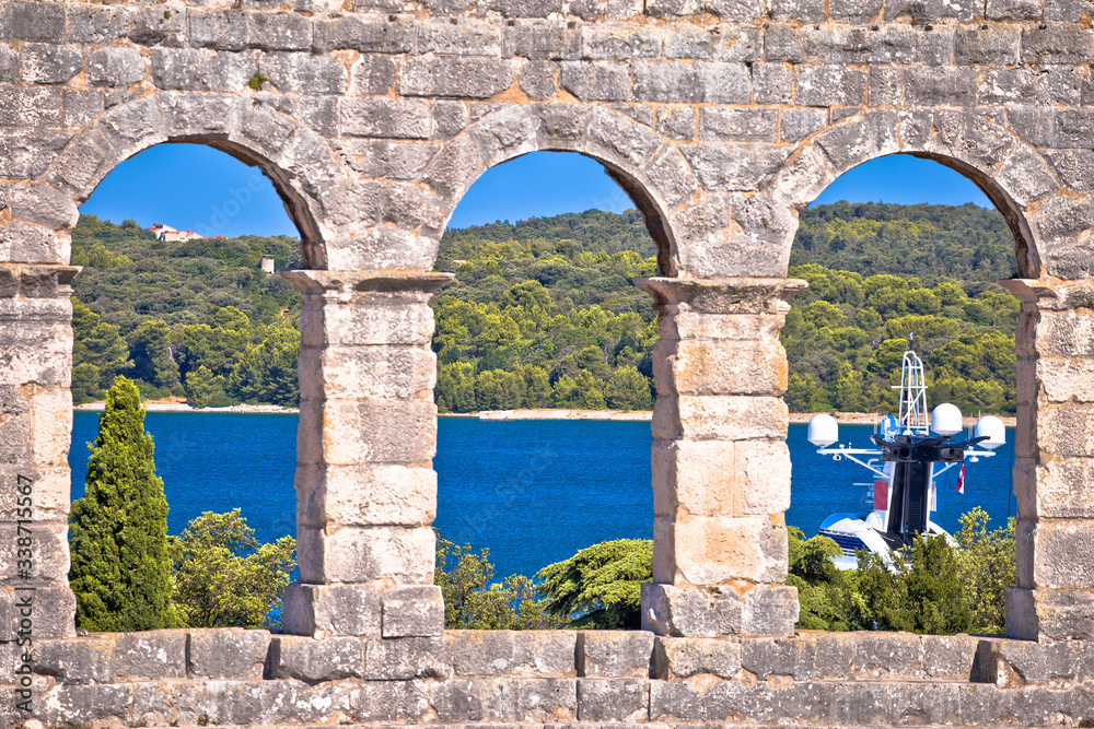 View through walls and arches of Arena Pula, Roman amphitheater in Istria